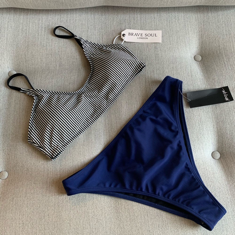 Striped bikini top and mid-rise blue bikini bottom